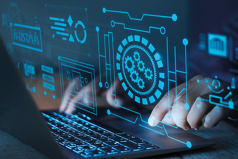 Immagine di una persona che scrive al computer con un ologramma digitale.